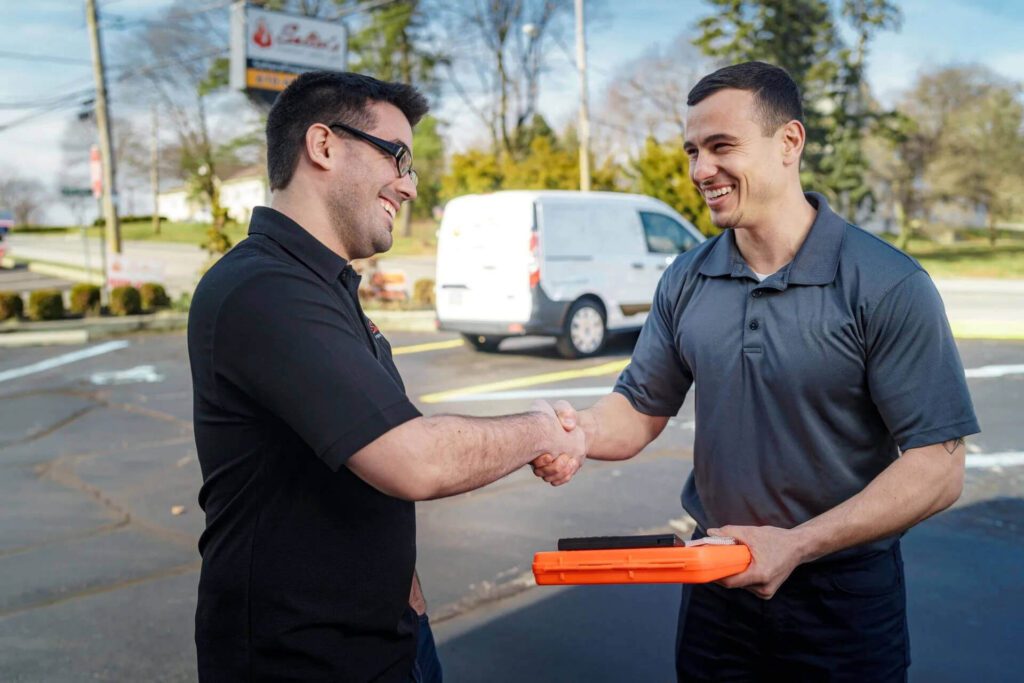 Image of our plumbers speaking to a customer in Brisbane