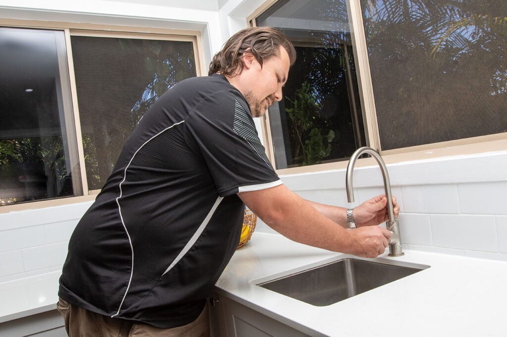 LiVE Services Group plumber conducting tap washer replacement at customers house
